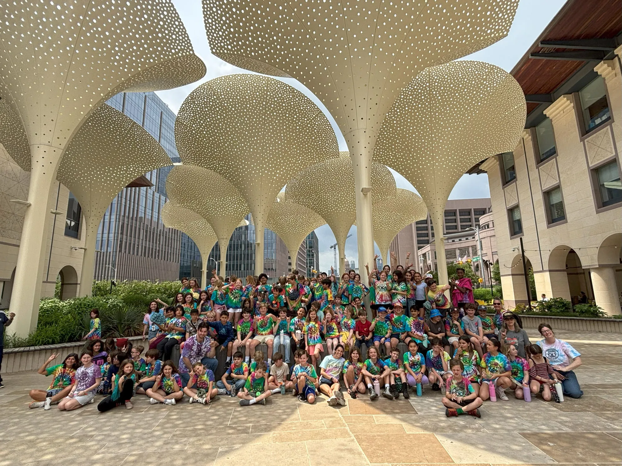 A large group of Austin ISD students on a college campus visit
