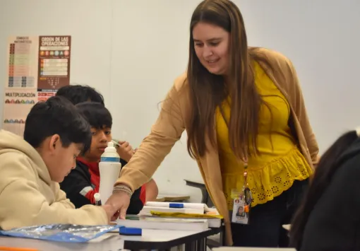 Teacher working with students in the Together We Learn project